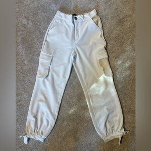 White loose cargo pants from BBJ Los Angeles.